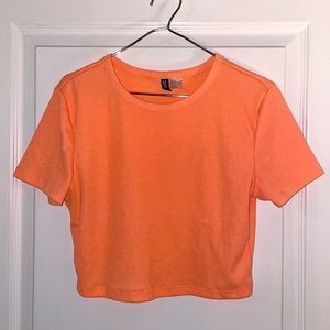 Brightly coloured orange crop top from H&M